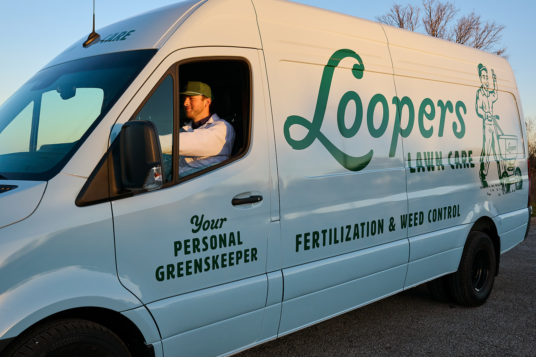 Loopers lawn care tech sunrise van driving