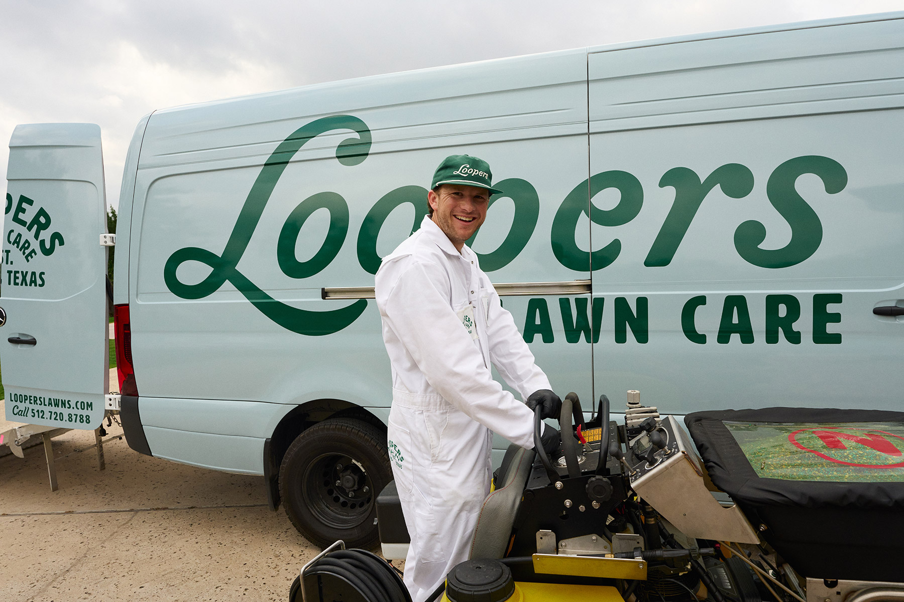 happy lawn care tech ride on van