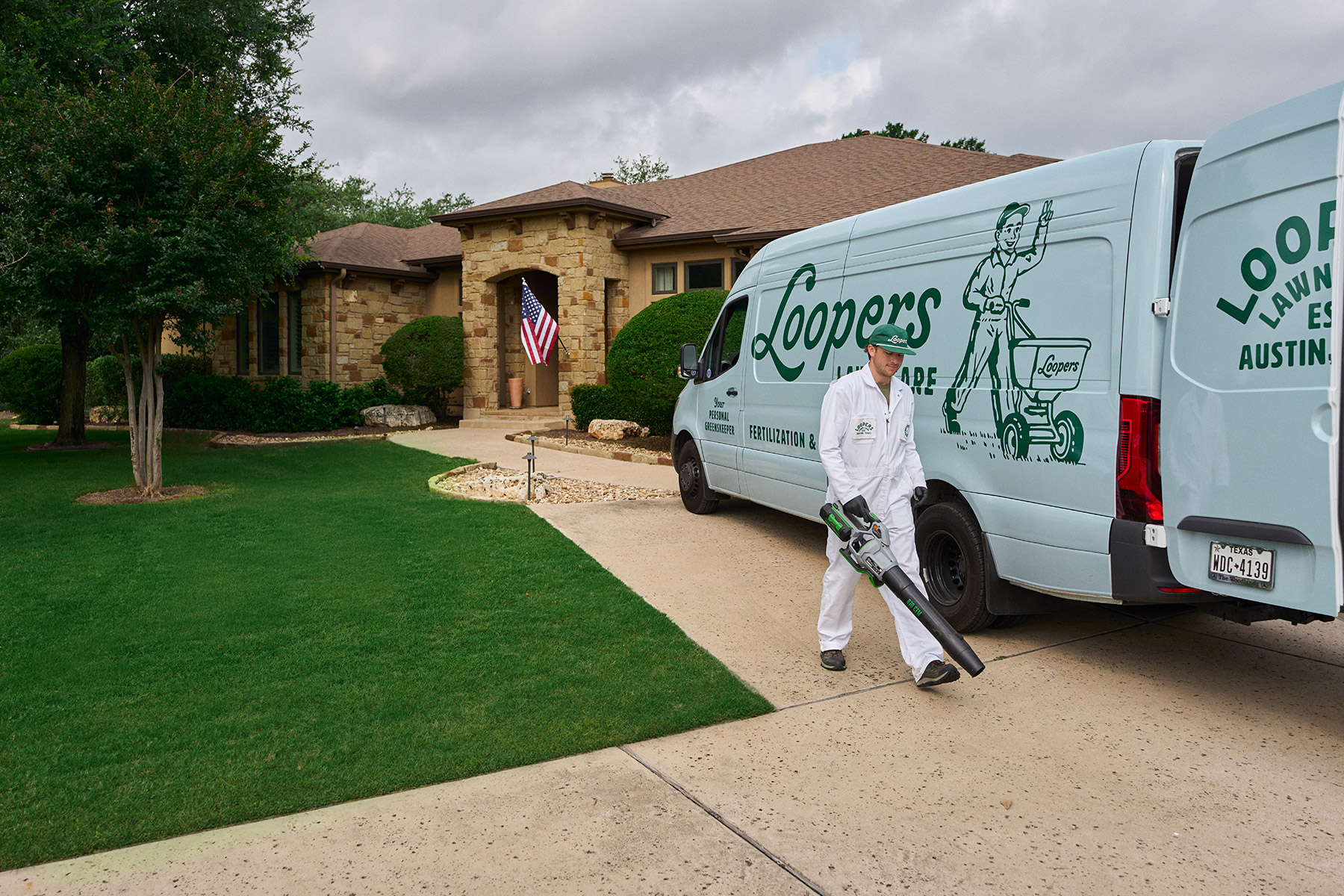 lawn care tech leaf blower pavement van home